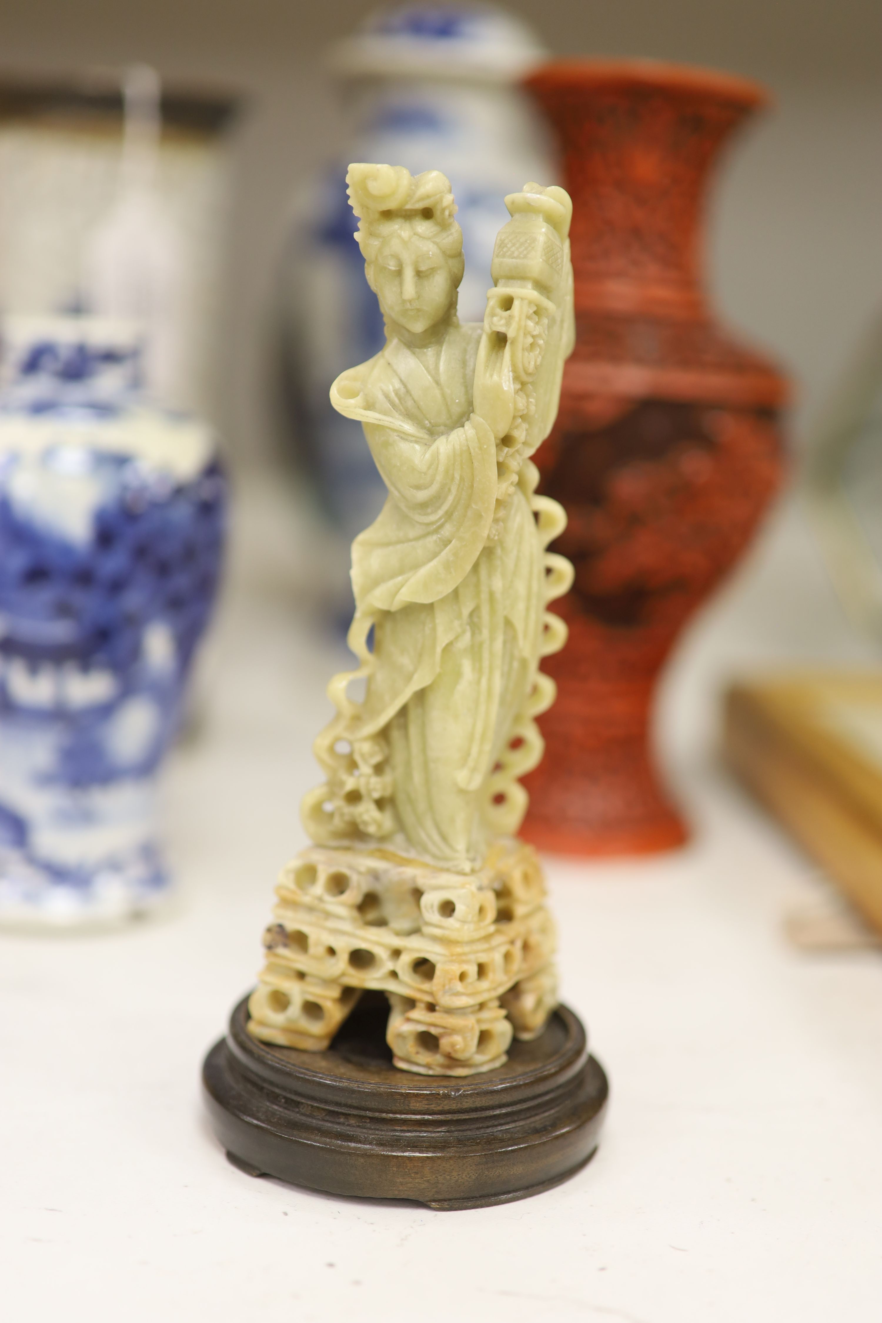 Three Chinese blue and white vases, a cloisonne enamel vase, another vase and a soapstone figure